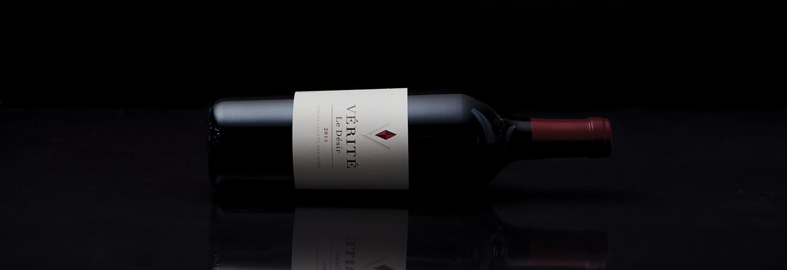 Le Desir bottle laying on its side